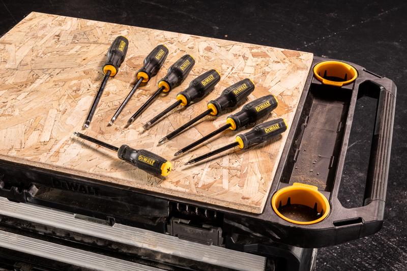 The 5in1 tower highlighting the raised edge work top being used with added ply board featuring DEWALT MAXFIT 8pc Screwdriver set DWHT65102-0