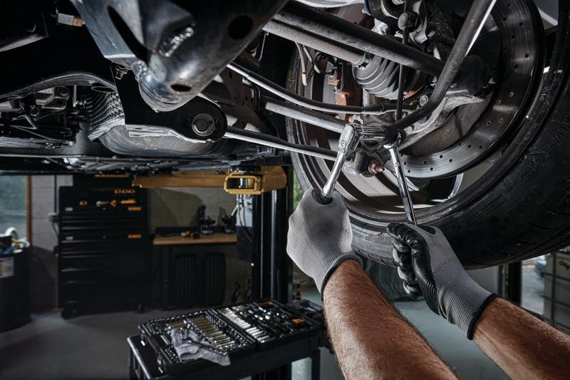 DEWALT 173 piece Mechanics tool set being used by a person.