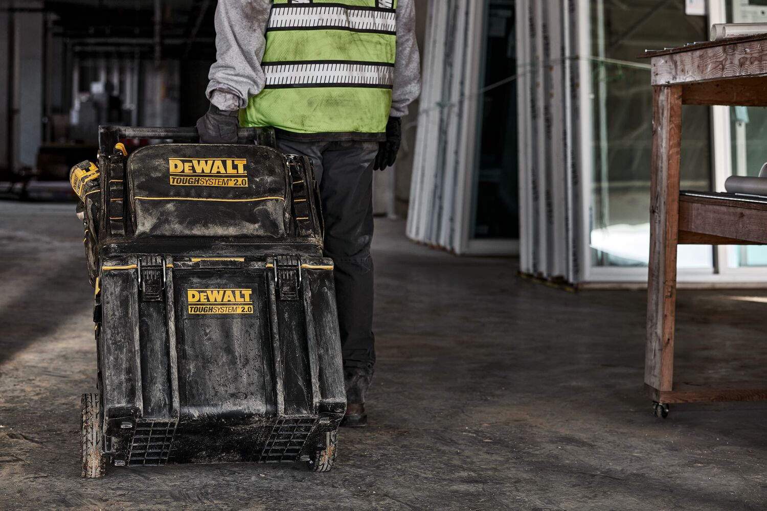 Tough system 2.0 toolbox being taken to a different area of worksite by a worker