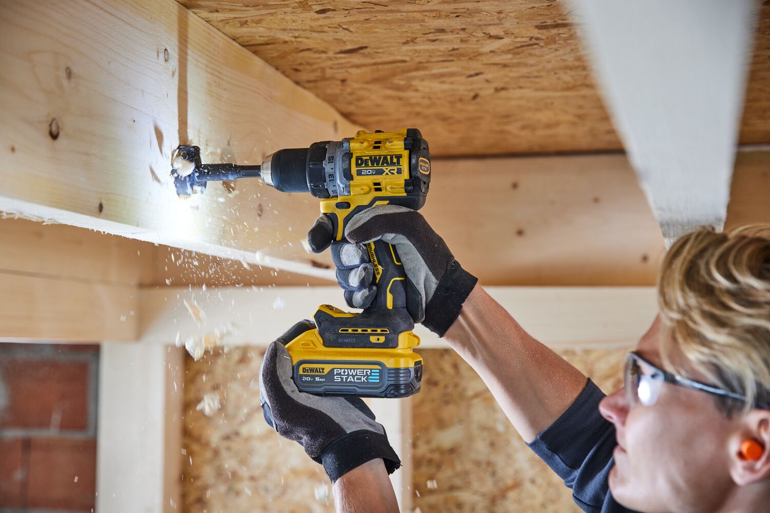 Drill being used overhead with DEWALT POWERSTACK five amp hour battery 